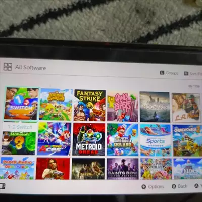  صورة 4 Nintendo switch مهكرة معاها 4 joycons مع شريطين وداخلها 20 لعبة مع ستور لتحميل الالعاب مجانا